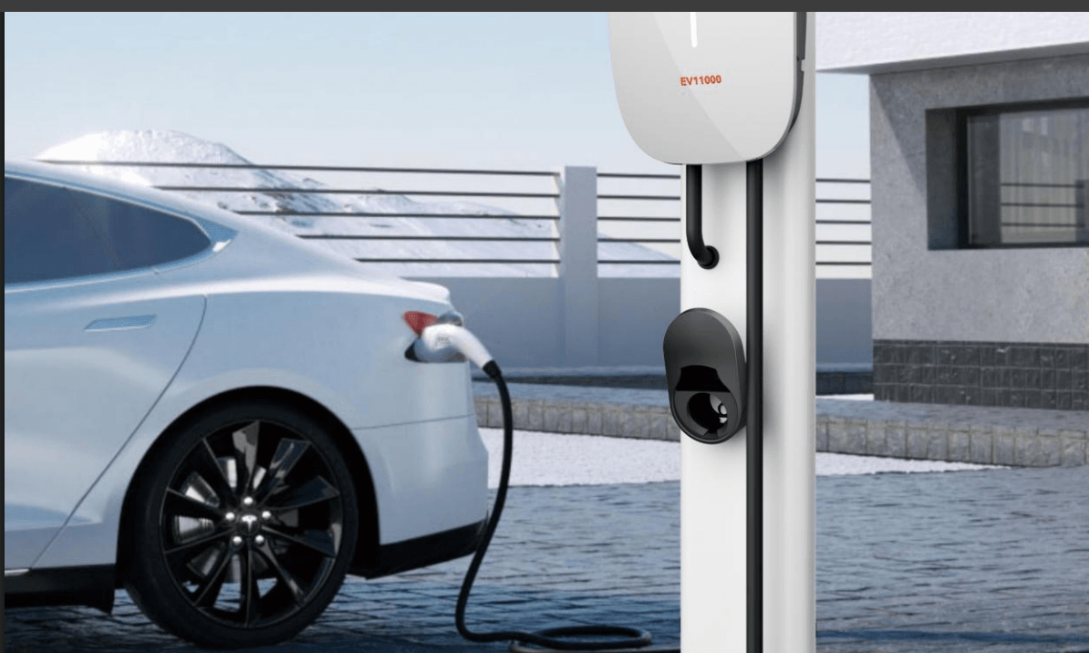 Electric car charging at home EV charging station outdoors with snow-covered mountains in background
