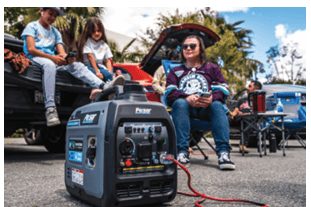 Portable solar generator powering outdoor gathering in a parking lot with people relaxing nearby