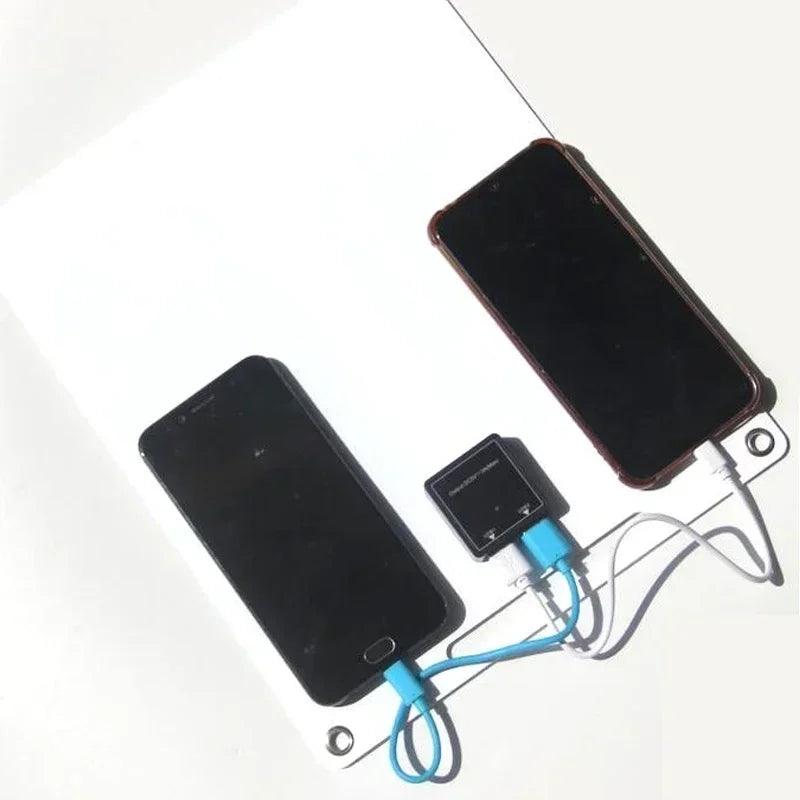Dual phones charging on SolarFlare solar generator panel, renewable energy solution