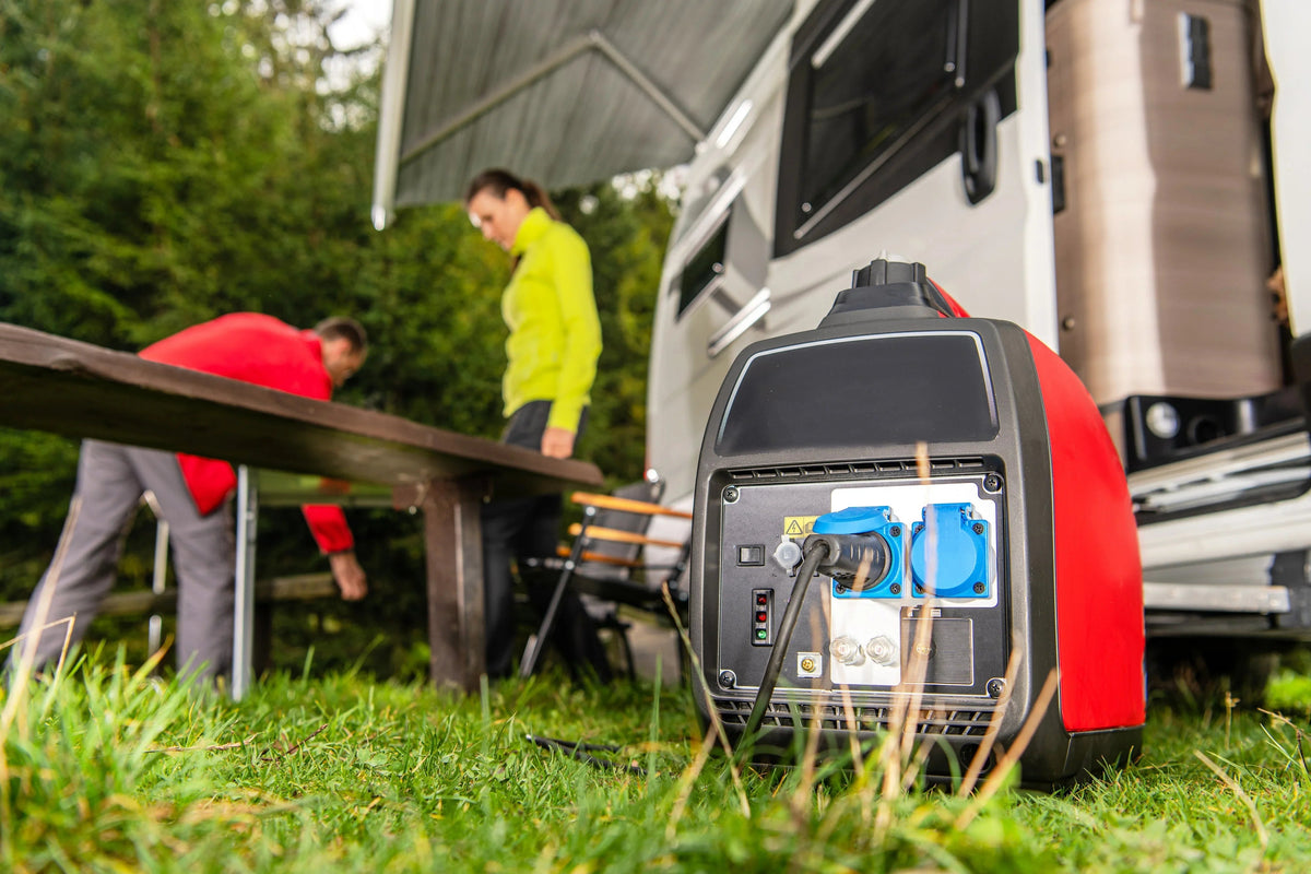 Portable generator powering a camper outdoors, with people setting up beside a solar-ready RV.