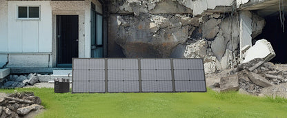 220W foldable solar panel with a rugged design, showcasing multiple solar cells, set against a damaged building backdrop.