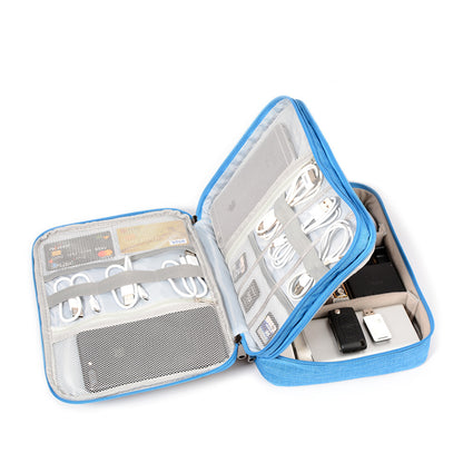 Blue travel organizer case with USB cables, chargers, and gadgets neatly stored inside