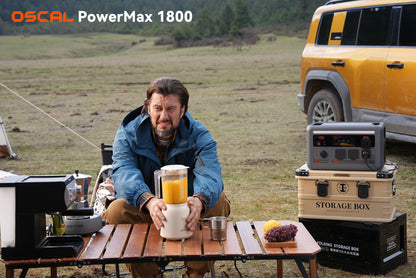 Outdoor portable power station setup powering blender and coffee maker next to SUV in nature