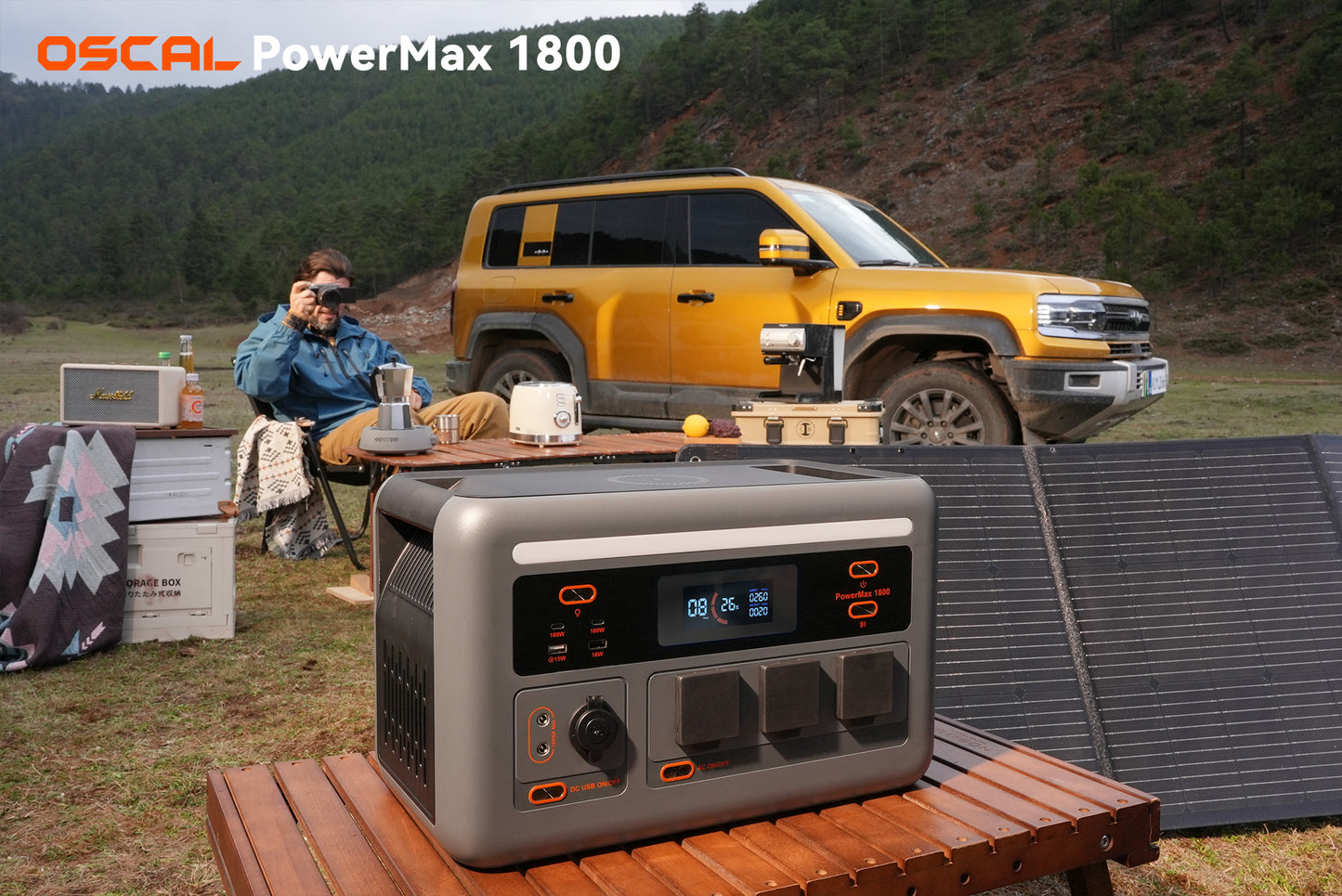 Portable solar generator and solar panels set up outdoors near SUV and camping gear