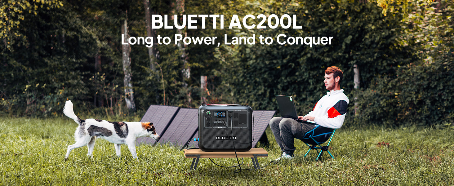 BLUETTI AC200L portable power station in a grassy area, connected to a laptop, with solar panels in the background.