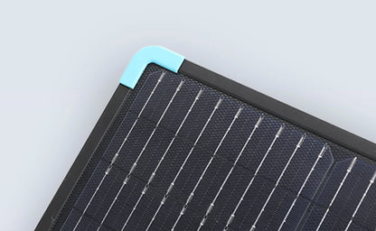 Portable solar panel features a dark, textured surface with silver connectors, and a light blue corner accent for style.