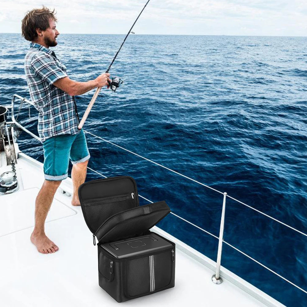 Black waterproof carrying case for BLUETTI EB3A, opened and positioned on a boat deck while person fishes nearby.