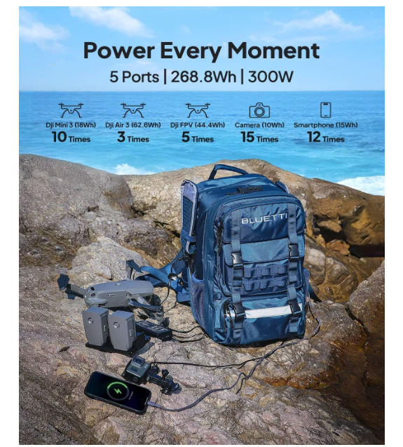 Portable solar generator backpack charging drone and smartphone outdoors by the ocean