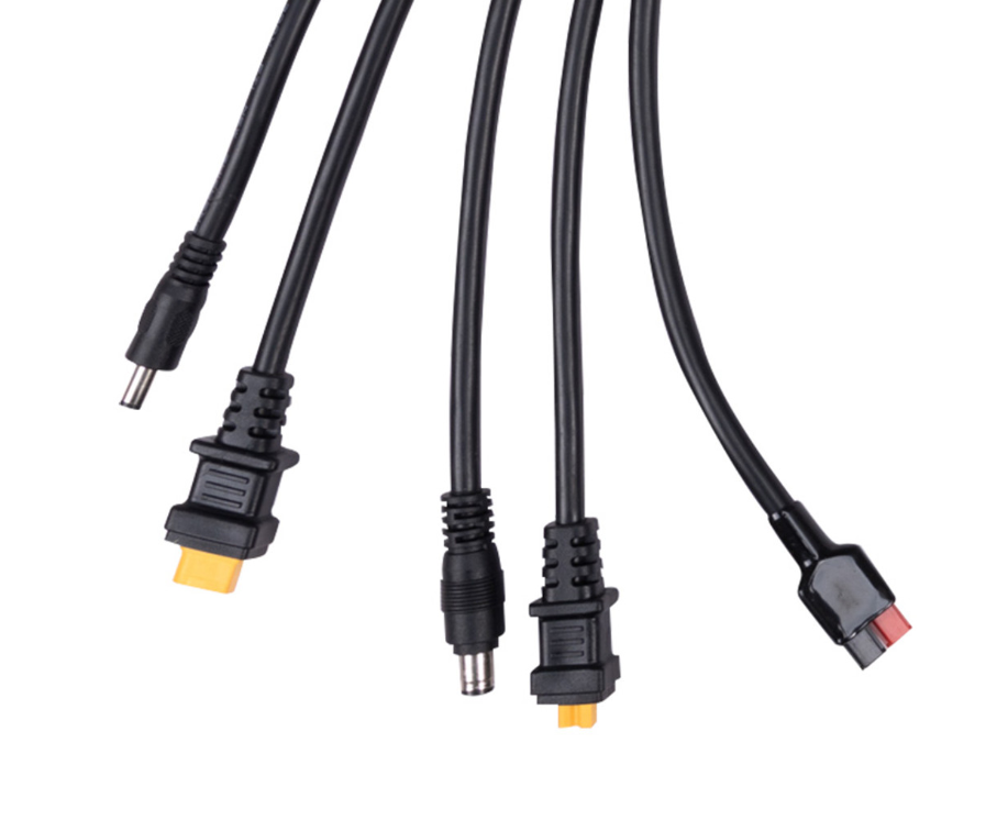 assorted solar generator adapter cables with multiple connector types on white background