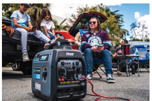 Portable solar generator powering outdoor gathering in a parking lot with people relaxing nearby