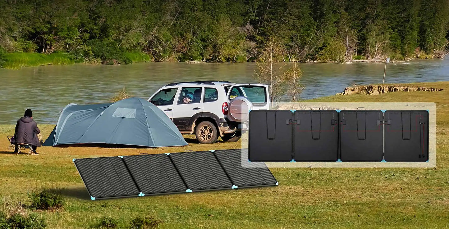 Portable Renogy 400W solar suitcase, black with blue accents, set up outdoors near a tent and SUV by the river.