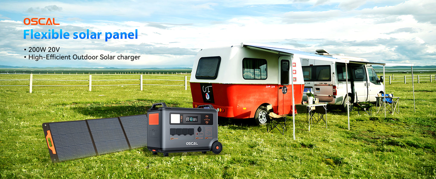 Flexible solar panel and portable generator set up next to a camper van in a grassy outdoor field