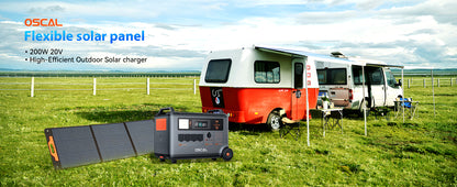 Flexible solar panel and portable generator set up next to a camper van in a grassy outdoor field