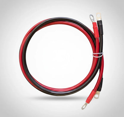 Red and black solar generator battery cables with ring terminals on white background